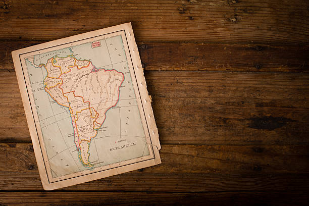 Old Color Map of South America,1800's, With Copy Space Color image of an old color map of South America, from the 1800's, sitting an angle on wood background, with copy space. topographic map photos stock pictures, royalty-free photos & images