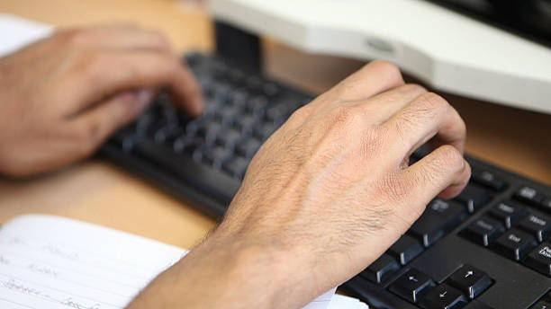 Indian Hands at the Keyboard stock photo