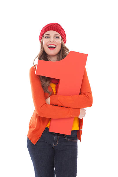 istock Woman holding number 1. 471412053