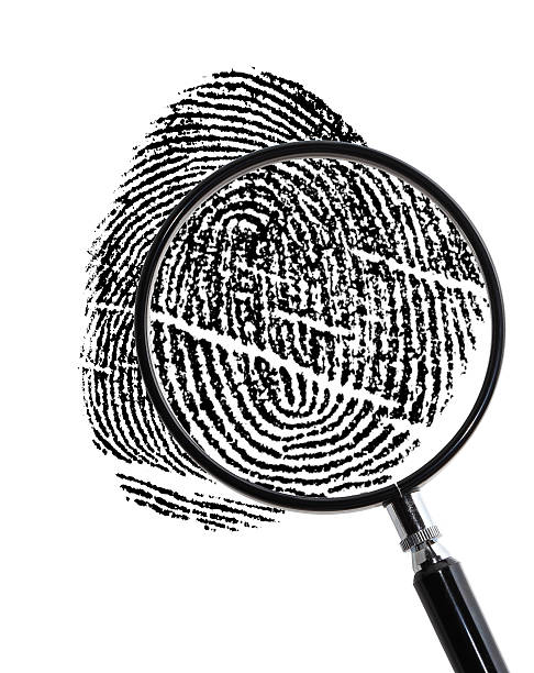 istock Magnifying glass used to examine fingerprint 471412433