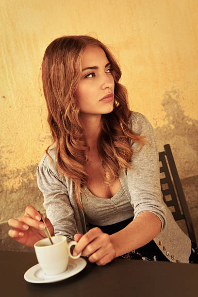 istock girl drinking coffee in Italy 471412715