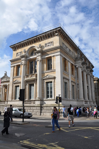 London, UK - April 4, 2023: People walking through the main entrance of  British Museum.