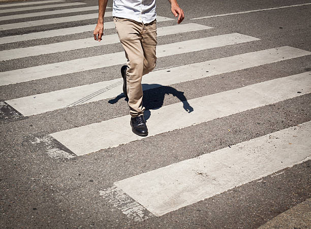 Man In Jeans Walking Across A Zebra Crossing Stock Photo - Download Image  Now - Crosswalk, Zebra Crossing, Crossing - iStock