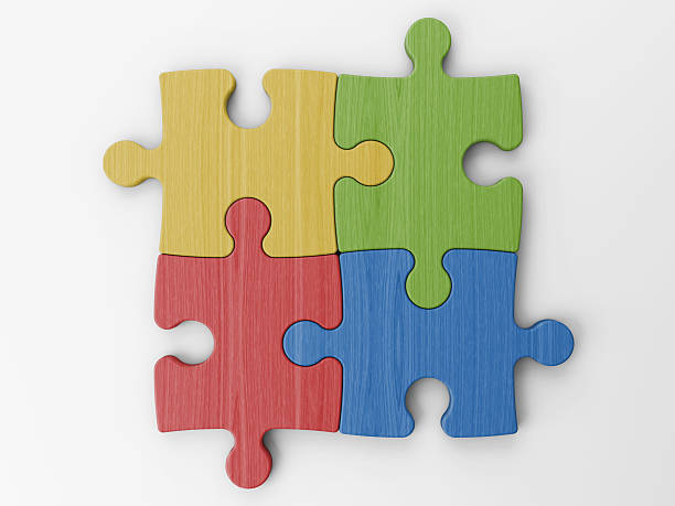 istock Four primary colored jigsaw pieces slotted together 471413368