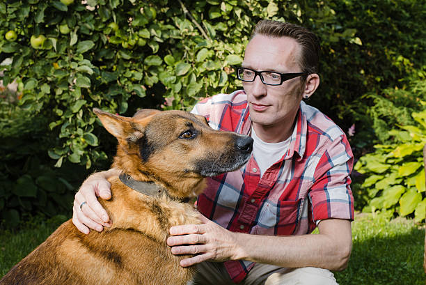 istock close up portrait man and his dog 471413552
