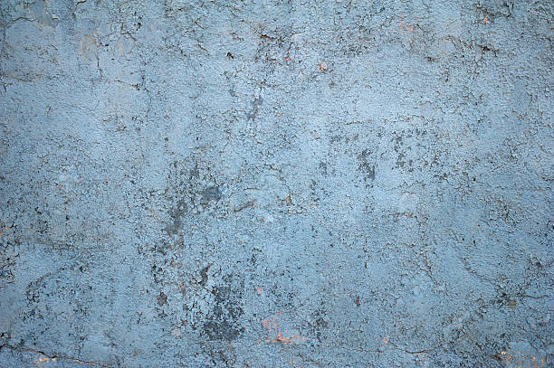 istock Texture of old wall covered with blue stucco 471413896