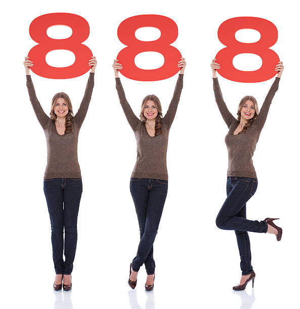 istock Woman holding number 8. 471414103