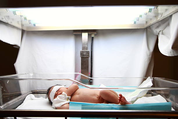 istock newborn baby under ultraviolet lamp 471415363