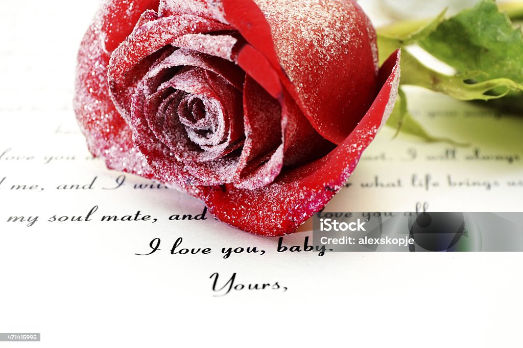 Love letter Close up of red rose on Love letter Arrangement Stock Photo