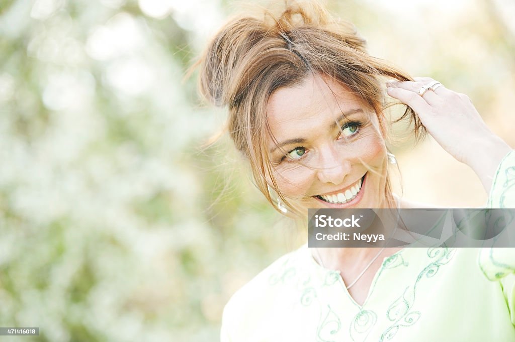 Beautiful mature woman smiling Beautiful mature woman smiling  Women Stock Photo