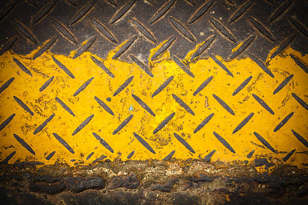 istock Dark steel floor plate paint with yellow pattern 471416191