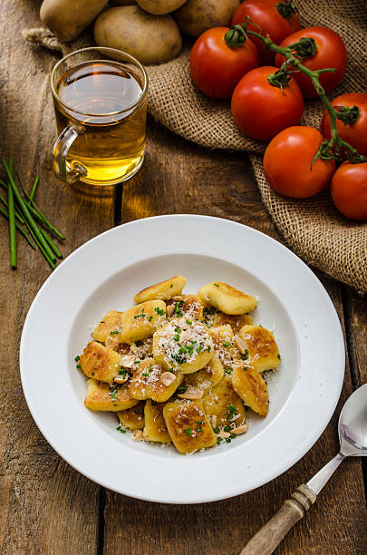 istock Homemade potato gnocchi with nuts and parmesan 471416440