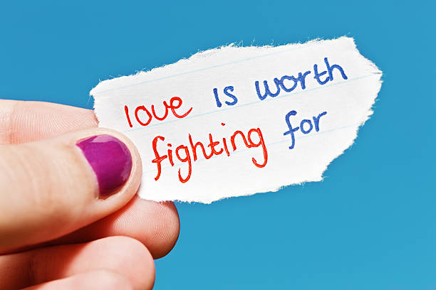 istock Love is worth fighting for says hand-drawn note 471416999