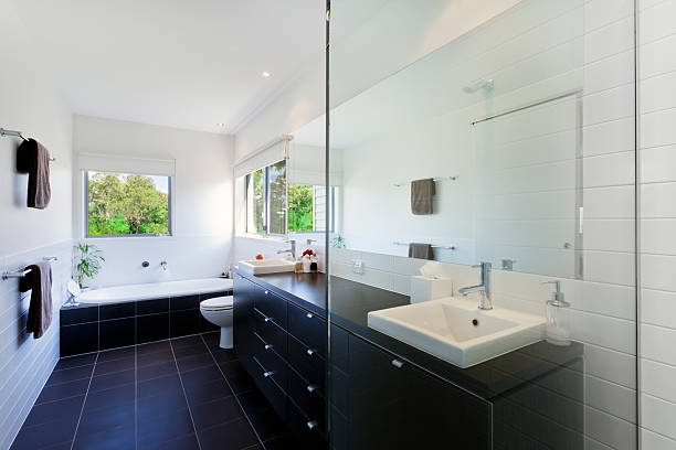 istock A clean, modern bathroom with dark tiles and white walls 471417801
