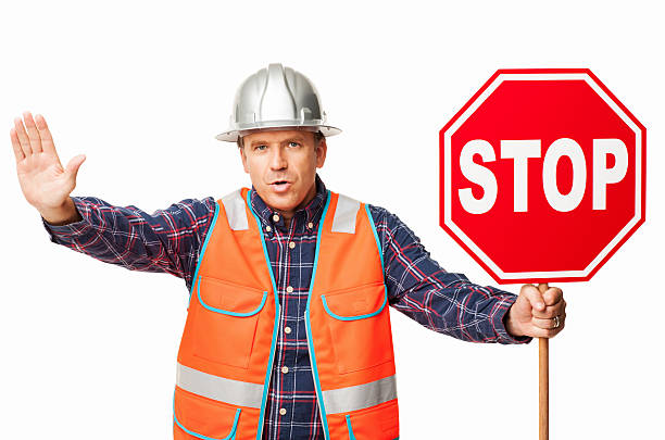 istock Male Construction Worker Holding a Stop Sign - Isolated 471418861