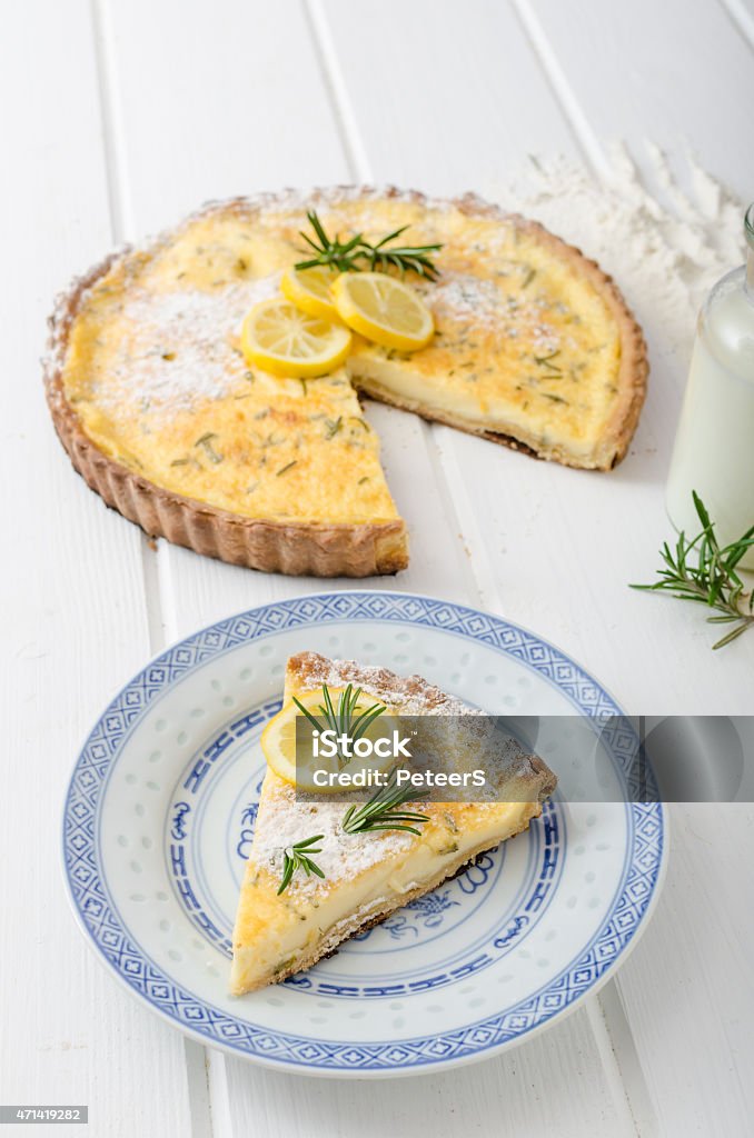 Lemon tart with rosemary Lemon tart with rosemary, sweet quiche, milk and fresh herbs from garden 2015 Stock Photo