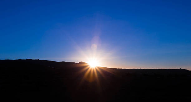 istock Gorgeous Sunrise with deep blue sky with dark mountain 471419516