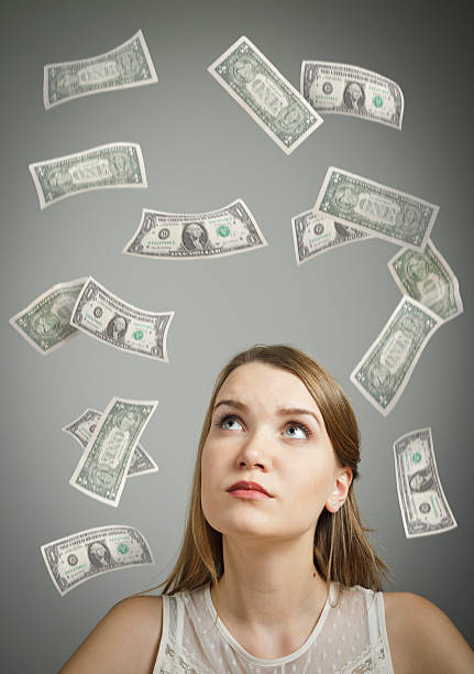 istock Girl in white and dollars. 471419950