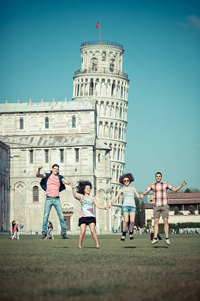 istock Happy Friends Jumping with Pisa Leaning Tower on Background 471420319