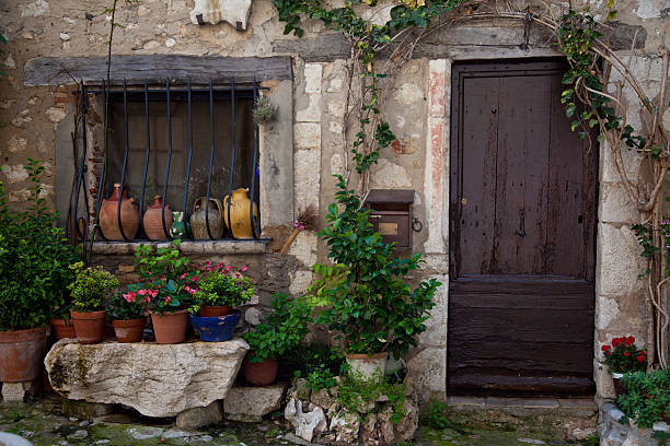 Aiguines, France - July 26, 2014: Facade of a French house with flowers