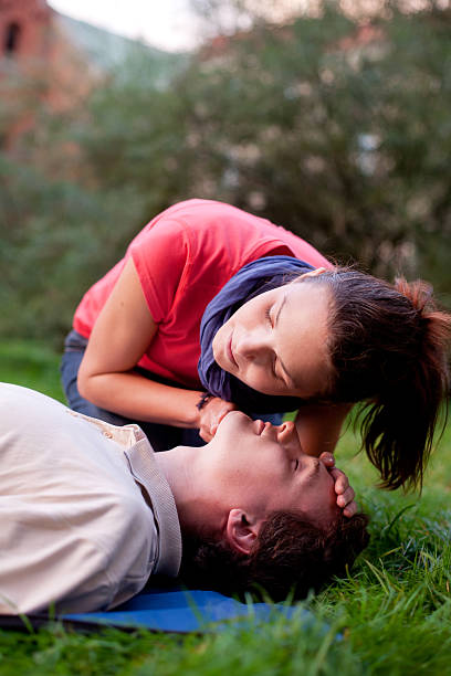 istock First aid - Look, listen and feel for breathing 471421841