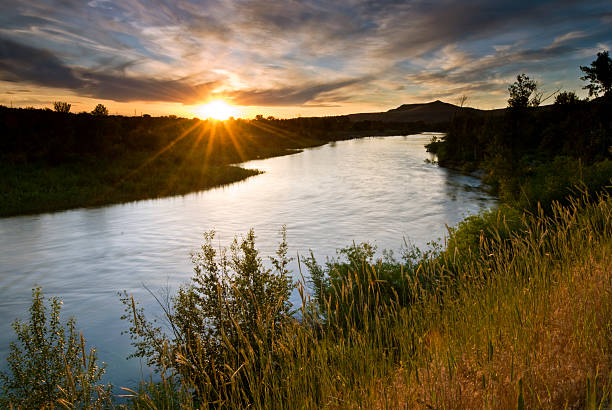 Boise River Sunset Beautiful sunset scene along Boise River, Idaho, USA on a fine spring evening boise river stock pictures, royalty-free photos & images