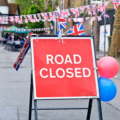 Royalty free stock photo of road closed sign due to a street party.