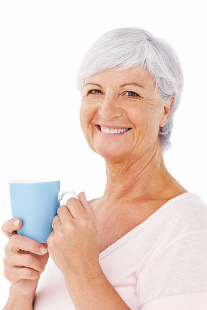 istock Elderly Woman Having Coffee - Isolated 471425053