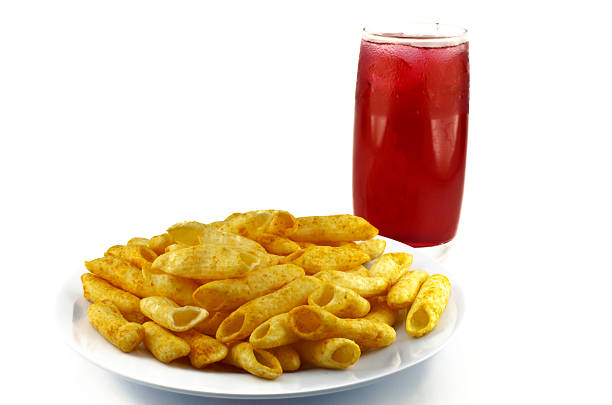 potato snack on dish with sweet drink on white background