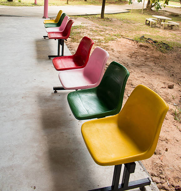 istock Colorful chairs in a park 471426932
