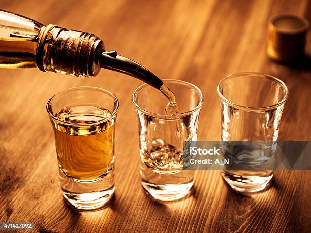 Filling Glasses Stock Photo - Download Image Now - Shot Glass, Alcohol - Drink, Pouring