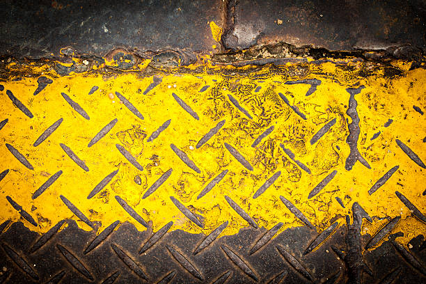 istock Dark steel floor plate paint with yellow pattern 471427095