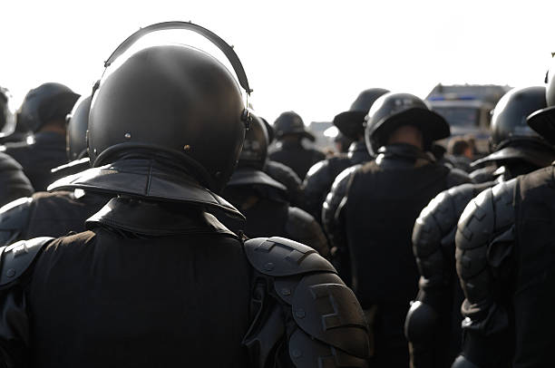istock Police officers in riot gear. 471427183
