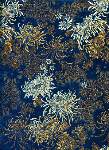 High resolution fragment of Chinese silk with flower motive. Chrysanthemums.
