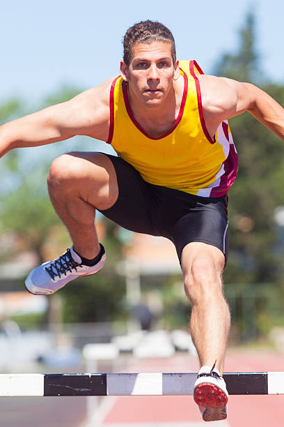 istock Male Track and Field Athlete during Obstacle Race 471428235