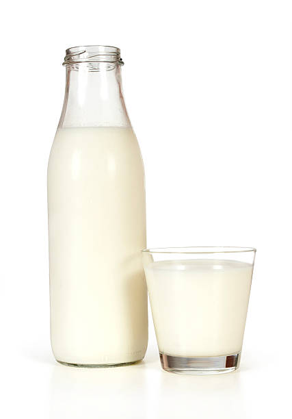 istock Glass of milk and bottle 471430025