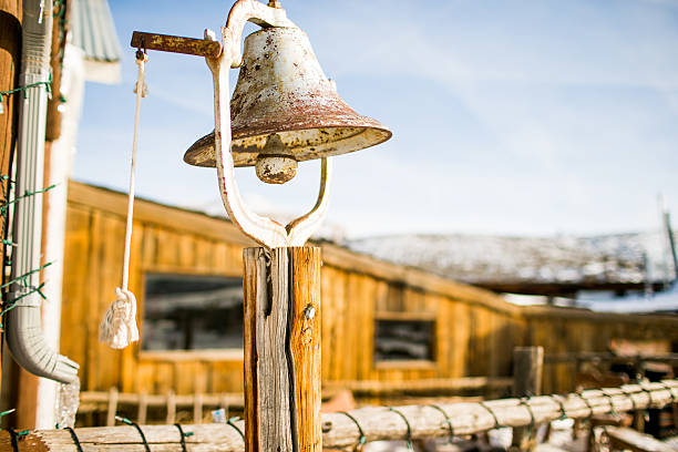 Old rusted metal bell on a farm or ranch
