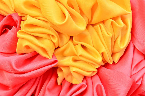 istock smooth elegant red and yellow satin background 471430863