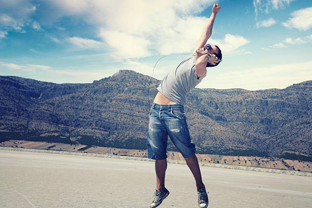 istock Attractive man enjoying music 471432887