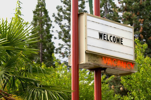Welcome sign along the roadway for a motel with vacancy. Similar files...