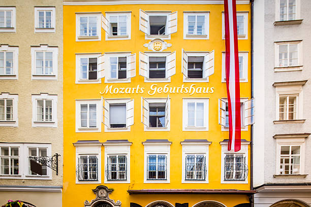 Birthplace Wolfgang Amadeus Mozart Getreidegasse Salzburg Austria Wolfgang Amadeus Mozart's Birthplace - the house where Mozart was born  - Mozarts Geburtshaus with Austrian Flag in the famous Getreidegasse 9, old town street in Salzburg, Austria wolfgang amadeus mozart stock pictures, royalty-free photos & images