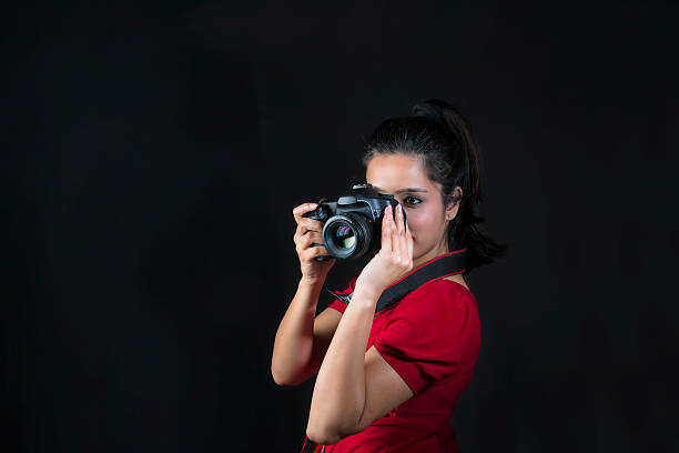 istock Beautiful young female photographer taking a shot 471433830