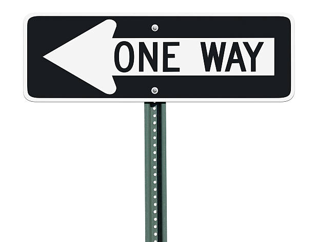 One Way Left Sign Isolated A one way sign over an isolated background pointing to the left. one way stock pictures, royalty-free photos & images