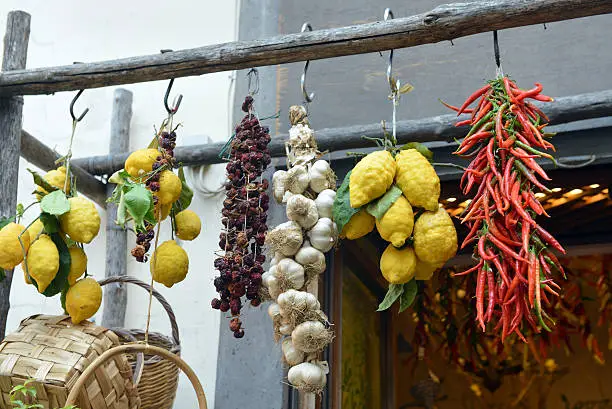 Lemons, garlic and Chili hanging outside a shop on the Amalfi Coast of Italy