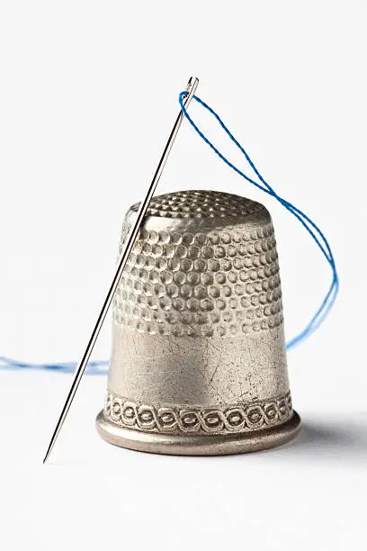 Close up of Thimble, Needle & Thread - great image for Sewing, Crafts and Hand made.