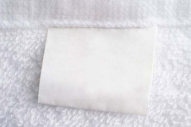 Close up of white towel with blank label