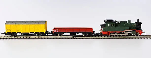 Photo of Isolated shot of vintage toy locomotive on white background