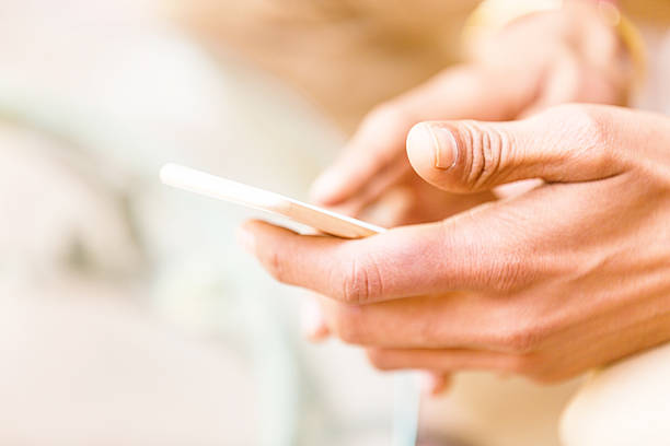 istock Hand Holding a Smart Phone 471436524