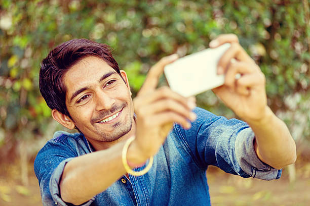 istock Young Man Taking Selfie With Smart Phone 471436560