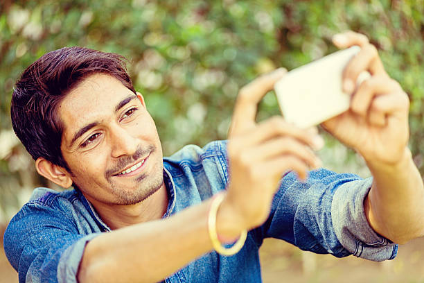 istock Young Man Taking Selfie With Smart Phone 471436566